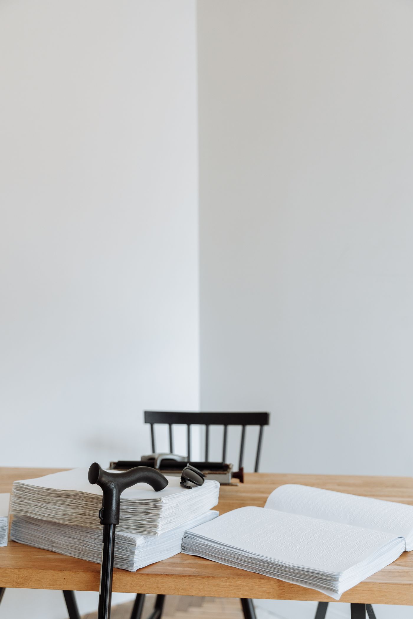 A stack of papers on a wooden table